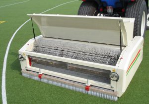 Treating artificial grass surfaces