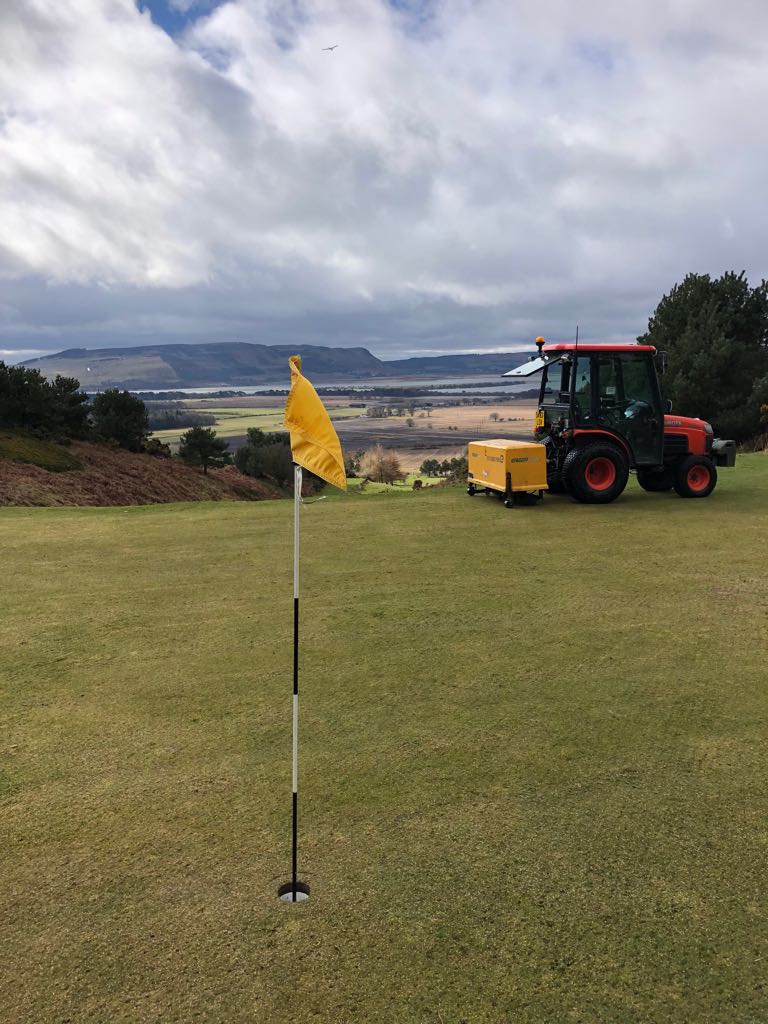 quadra tines used to core a golf green